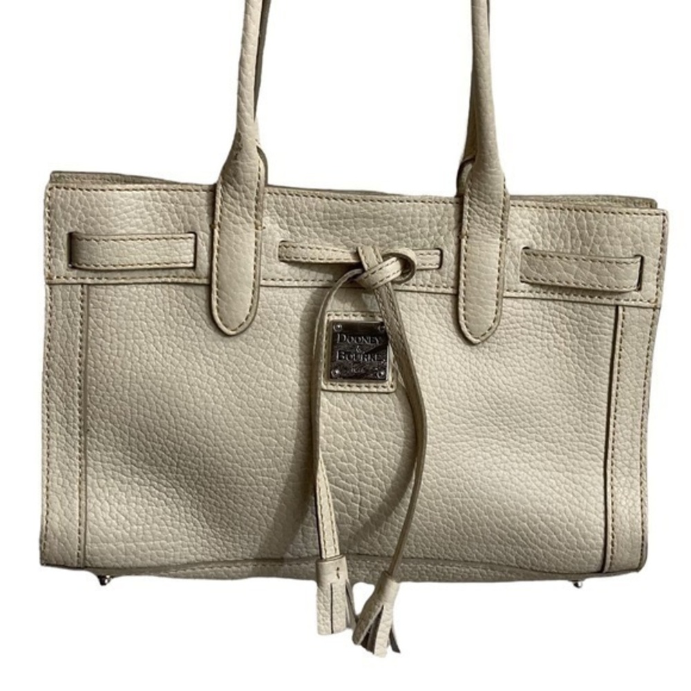 Dooney and Bourke cream pebbled leather tassel tote bag